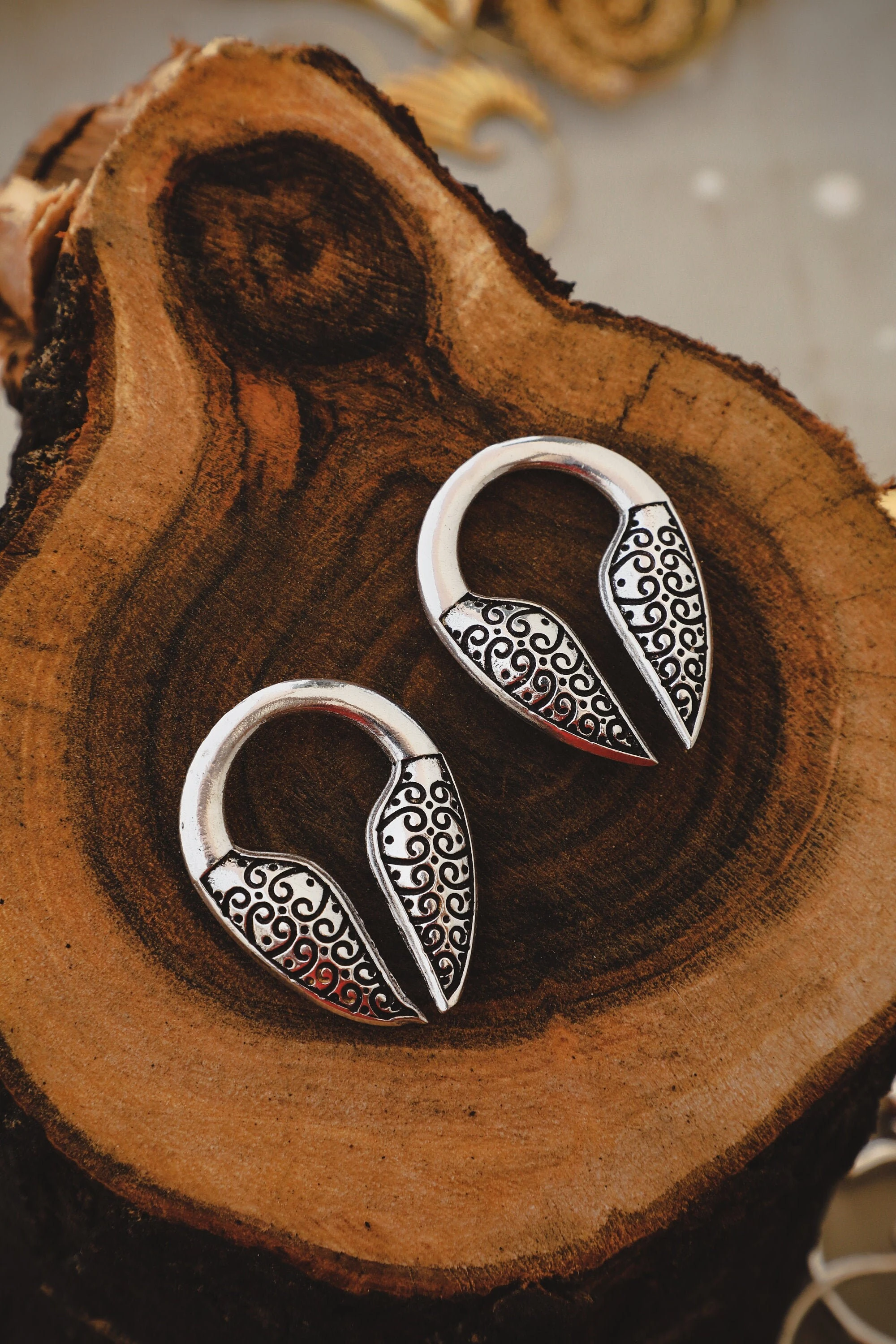 Exquisite handcrafted tribal-inspired earrings in sterling silver, featuring intricate filigree detailing