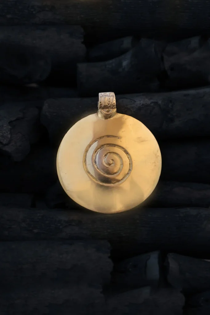 Stone Age Brass Pendant
