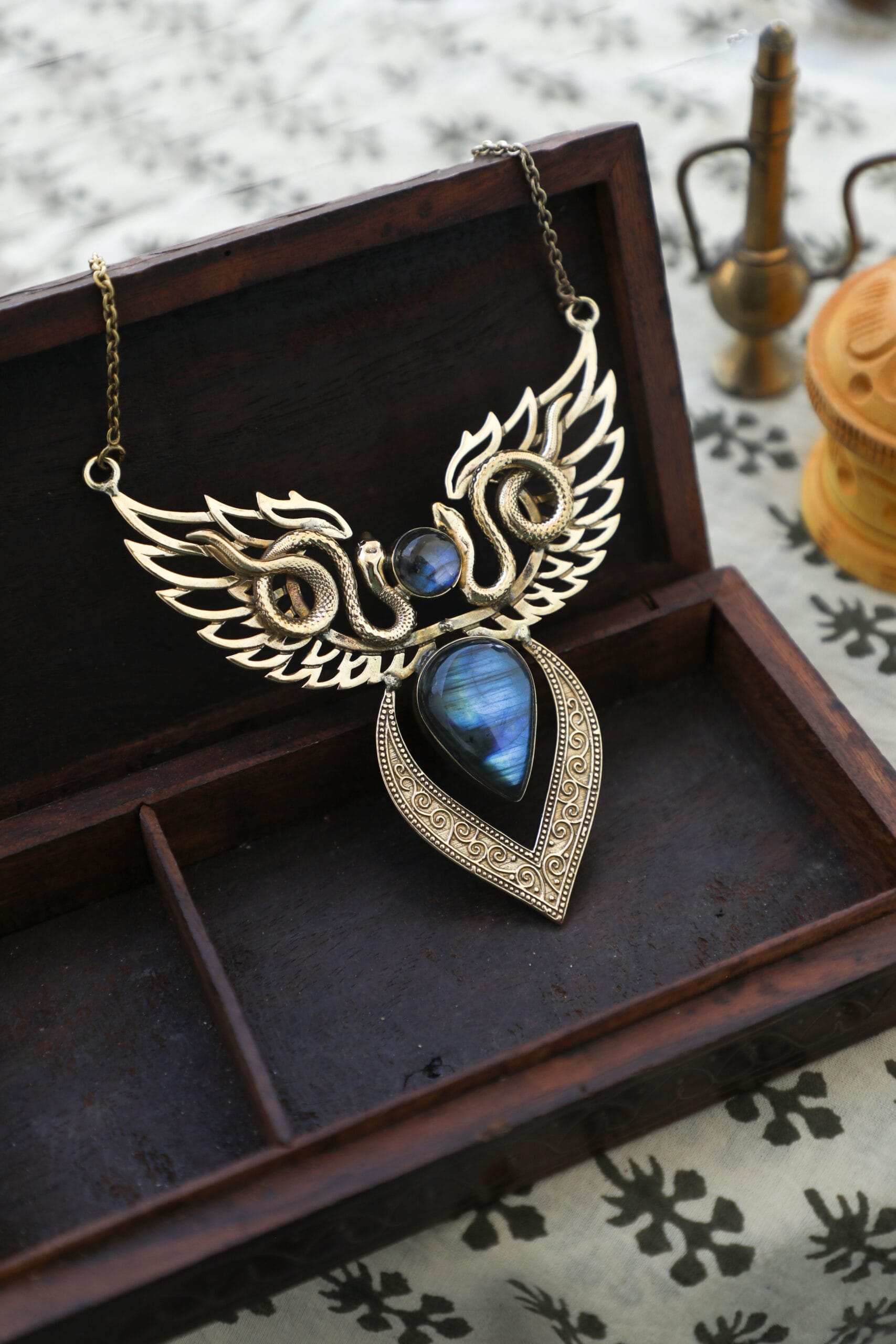 Handcrafted brass necklace from TribalDesert, featuring an intricate winged design with a stunning moonstone centerpiece
